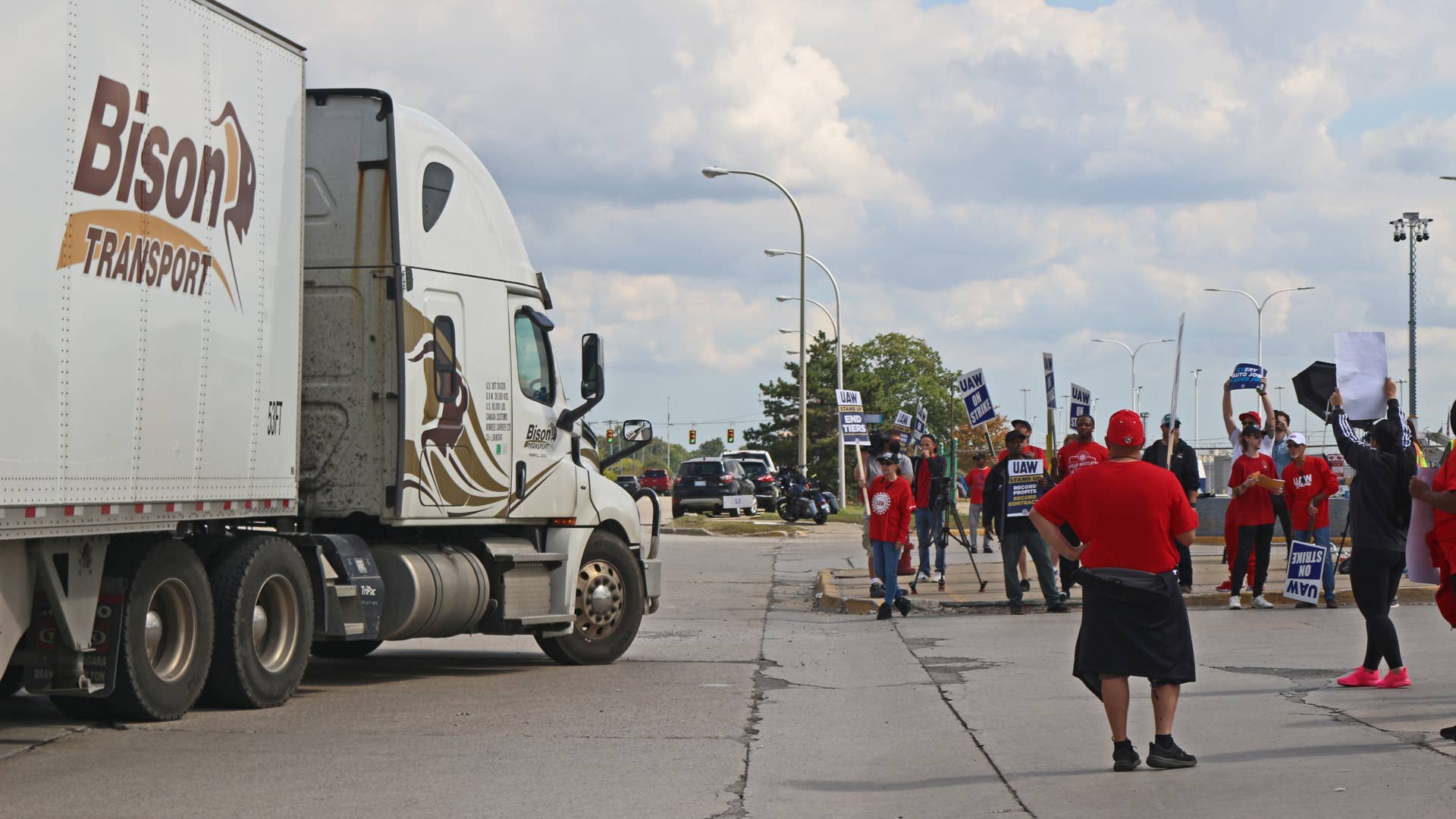 UAW Picketers block a truck attempting to enter the Michigan Assembly facility Friday.