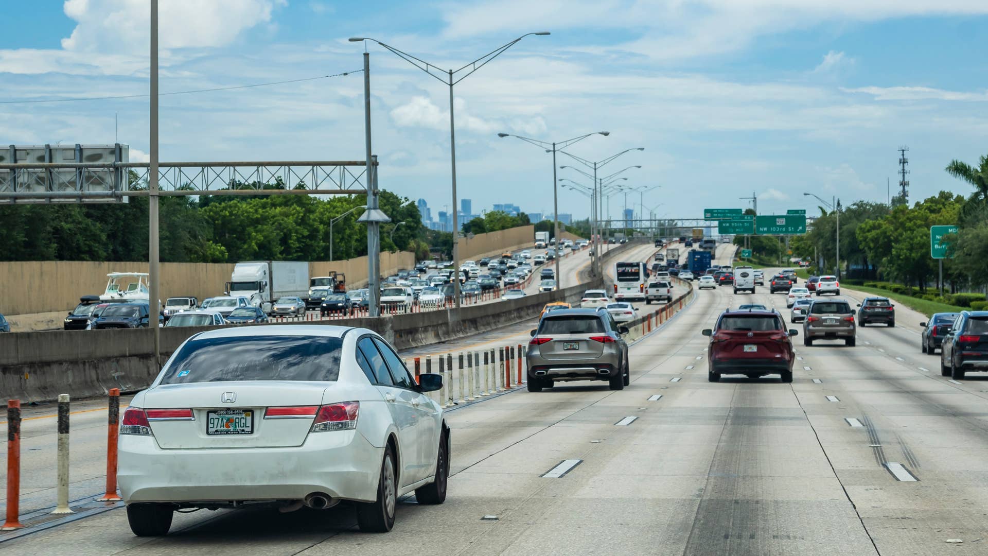 Miami Beach, Florida, USA - Aug 04, 2023: POV of driver entering the city limits of Miami via the southbound lane of Interstate 95 or I-95.