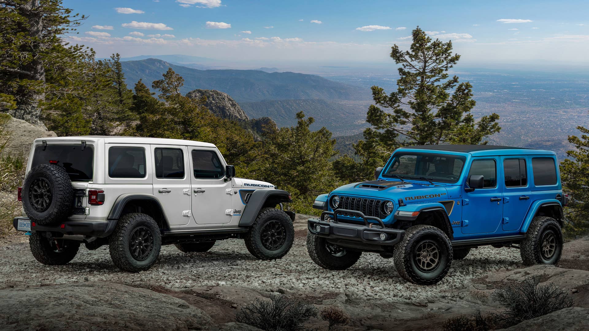Rubicon 20th Anniversary editions: 2023 Jeep® Wrangler Rubicon 4xe (left, shown with optional Hinge-Gate Reinforcement by Mopar) and 2023 Jeep Wrangler Rubicon 392