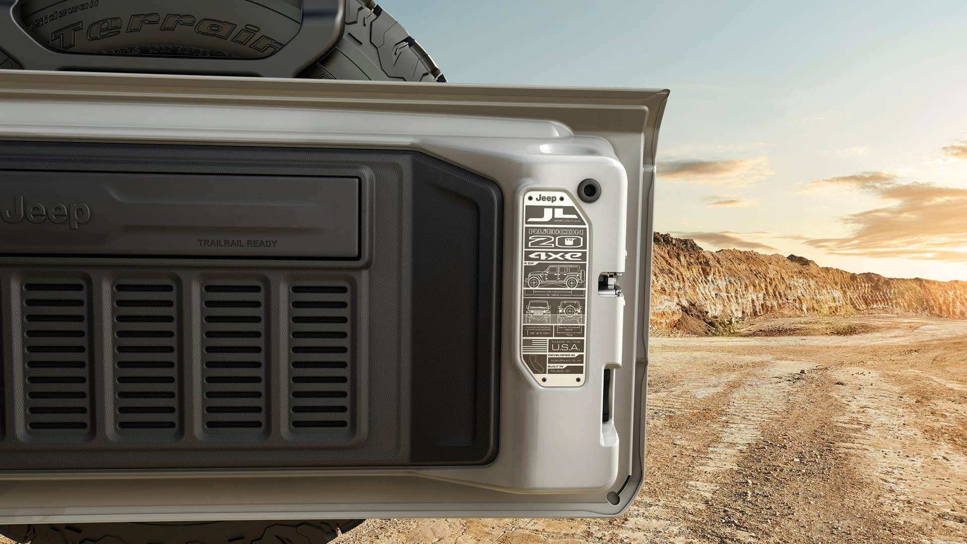 The 2023 Jeep® Wrangler Rubicon 4xe 20th Anniversary edition features a special swing gate plaque to commemorate two decades of legendary Rubicon 4x4 capability