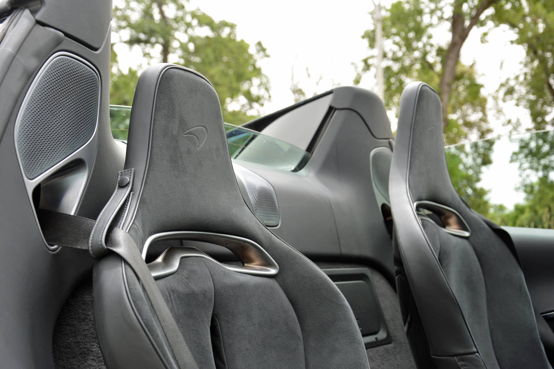 2025 McLaren Artura Spider interior with roof down front seats