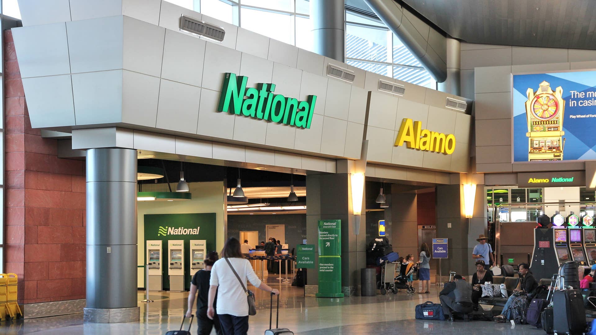 LAS VEGAS, USA - APRIL 13, 2014: Alamo and National car rental airport office in Las Vegas. Both brands are owned by Enterprise Holdings, company employing 74,000 people (2013).