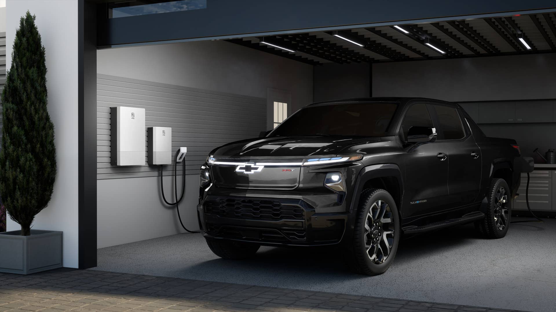 Rendering of a 2024 Chevrolet Silverado EV RST in a residential garage with anticipated GM Energy offerings. Simulated products shown. Actual production model may vary. Simulated vehicle shown. Actual production model may vary.