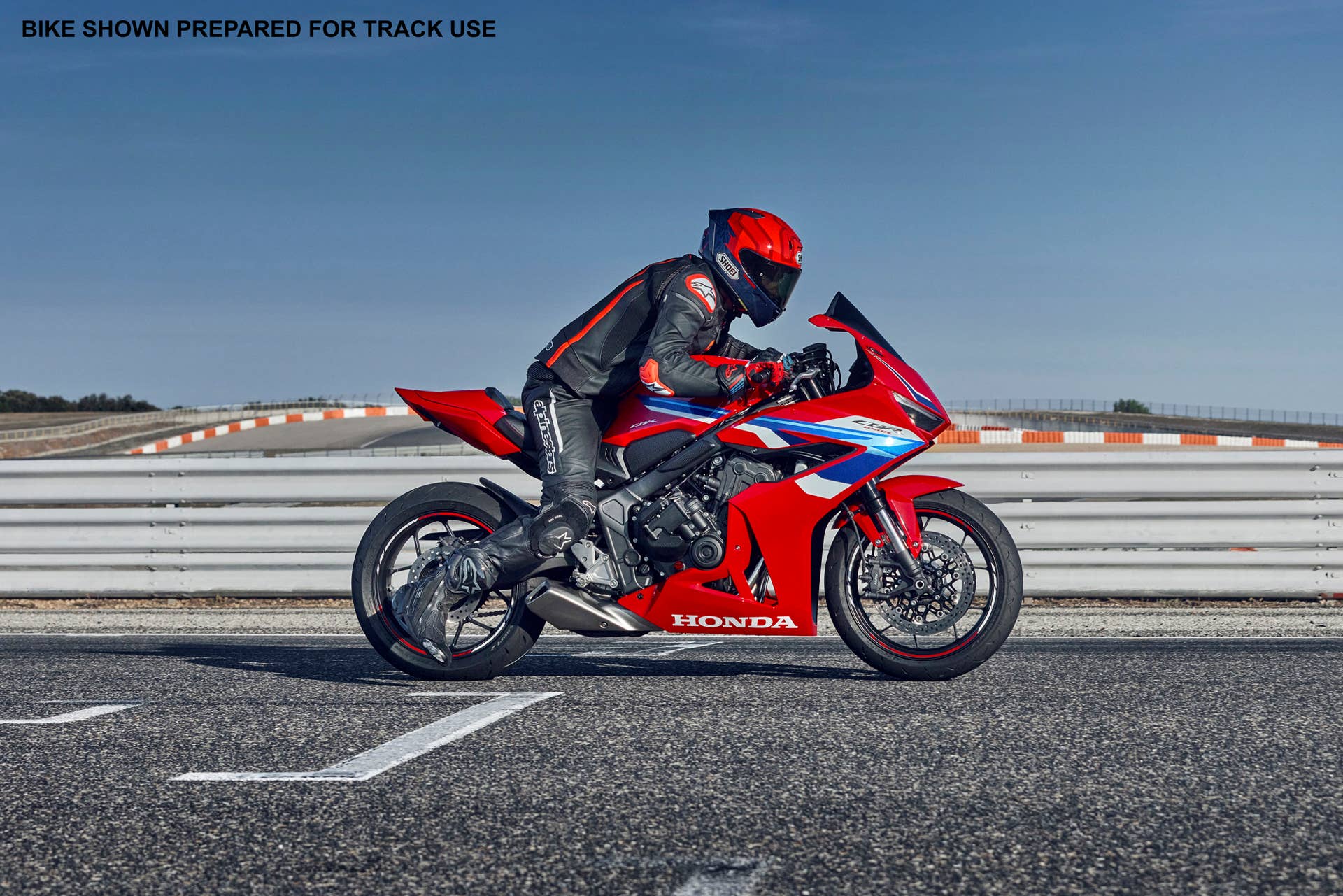 2025 Honda CRB1000RR-R Fireblade SP motorcycle on track, side view.