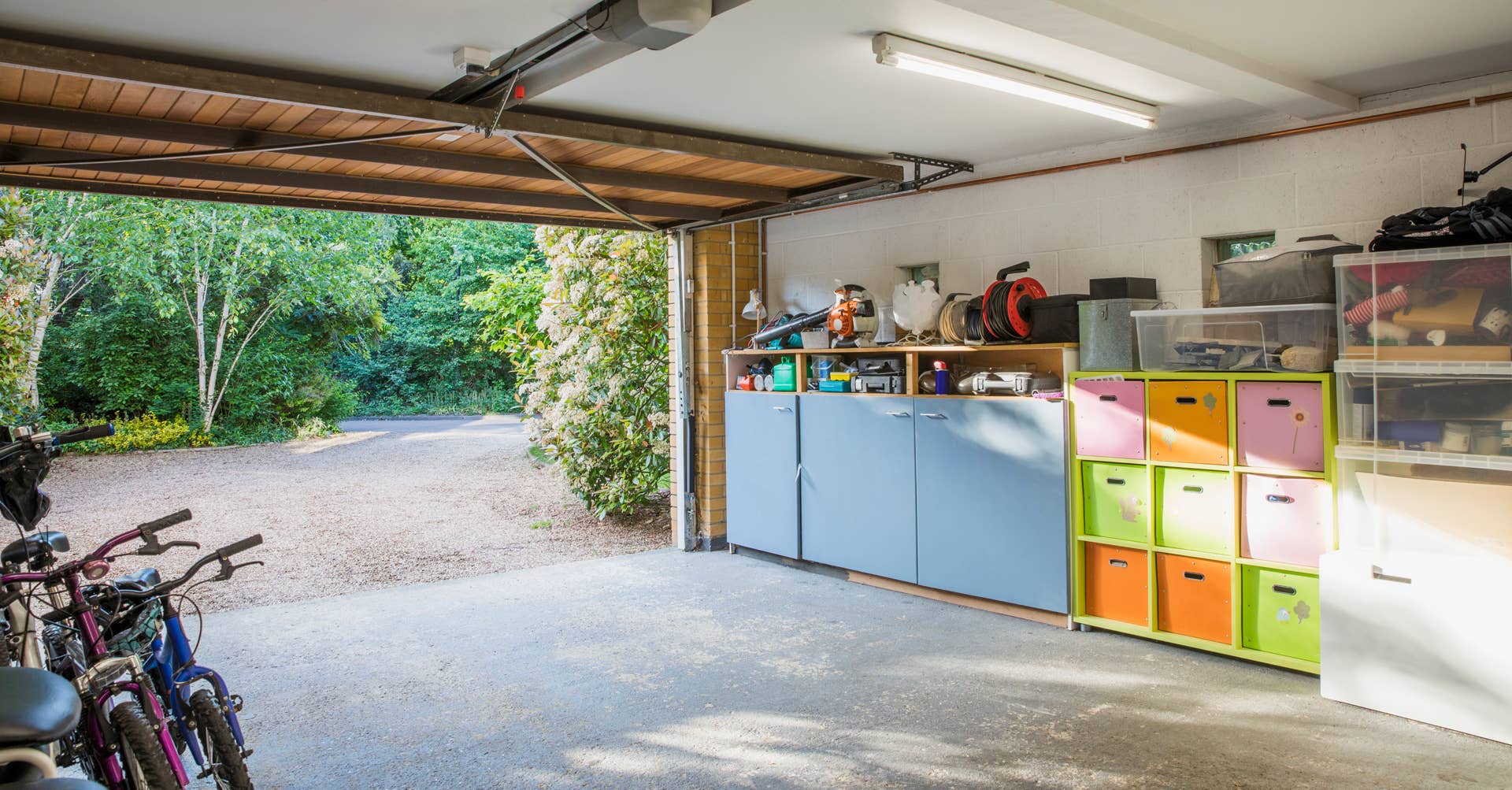 Sunshine over storage bins in open, organized home garage