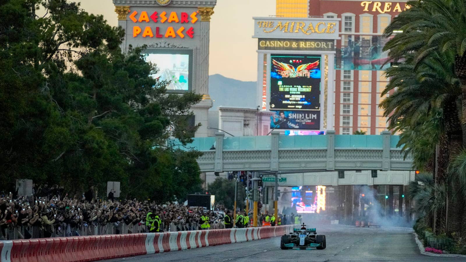 Nov 5, 2022; Las Vegas, Nevada, USA; Mercedes-AMG Petronas driver George Russell drives on the track during the Formula One Las Vegas Grand Prix Launch Party at Las Vegas Strip. Mandatory Credit: Ray Acevedo-USA TODAY Sports
