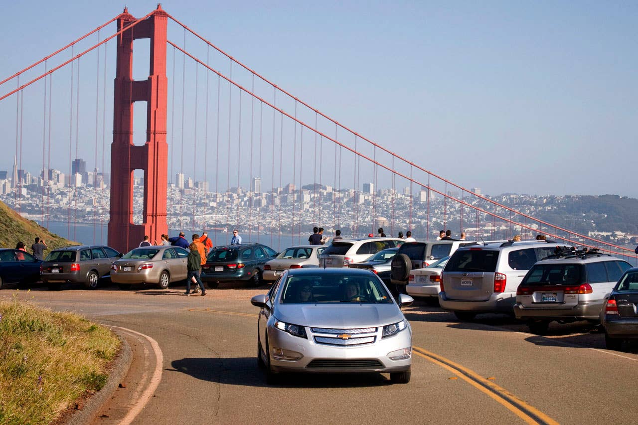 A pre-production Chevrolet Volt drives near the Golden Gate Bridge while on an engineering development drive in San Francisco, California Saturday, April 25, 2010. The Volt will be available in California during the last quarter of 2010. (Photo by Martin Klimek for Chevrolet)