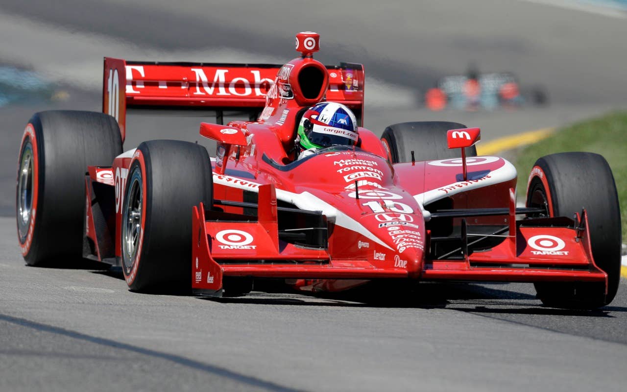 Dario Franchitti of Scotland drives his race car during qualifying Saturday, July 3, 2010, for the IndyCar Series' Watkins Glen Camping World Grand Prix at The Glen in Watkins Glen, N.Y. Franchitti qualified fourth for Sunday's race. (AP Photo/Mel Evans)