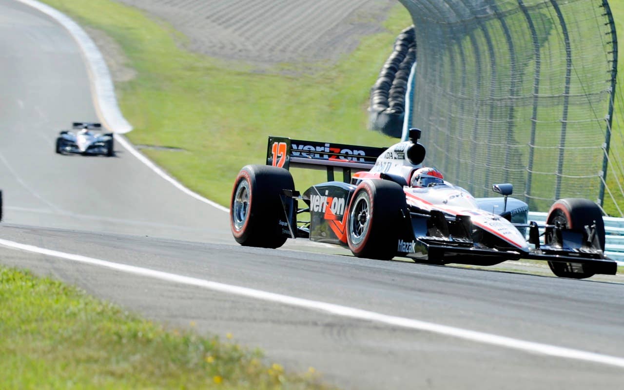 Will Power of Australia leads a group of race cars Sunday, July 4, 2010, on his way to winning the IndyCar Series' Watkins Glen Camping World Grand Prix at The Glen in Watkins Glen, N.Y. (AP Photo/Douglas Ford Rea)