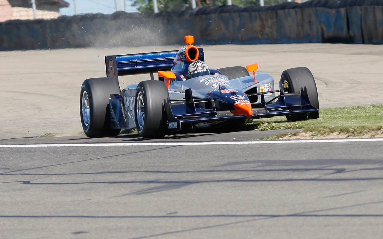 E.J. Viso of Venezulea loses control of his his race car in turn one Saturday, July 3, 2010, during practice during practice for the IndyCar Series'  Watkins Glen Camping World Grand Prix at the Glen in Watkins Glen, N.Y. for , N.Y. (AP Photo/Mel Evans)