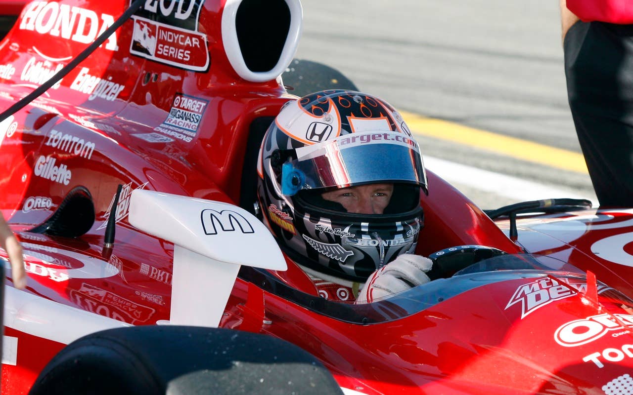 Scott Dixon of New Zealand sits in his race car Saturday, July 3, 2010, during practice during practice for the IndyCar Series'  Watkins Glen Camping World Grand Prix at the Glen in Watkins Glen, N.Y. for , N.Y. (AP Photo/Mel Evans)