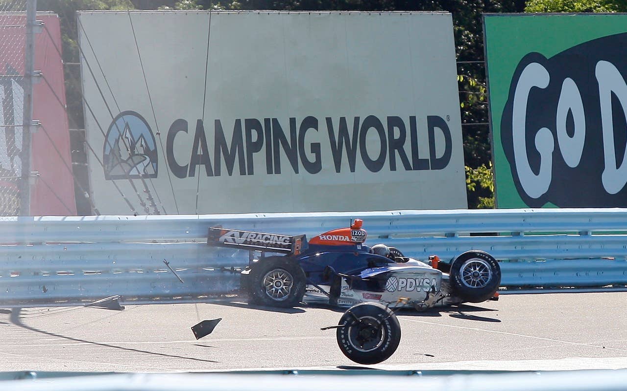 E.J. Viso of Venezulea crashes his race car Saturday, July 3, 2010, during practice during practice for the IndyCar Series'  Watkins Glen Camping World Grand Prix at the Glen in Watkins Glen, N.Y. for , N.Y. (AP Photo/Mel Evans)
