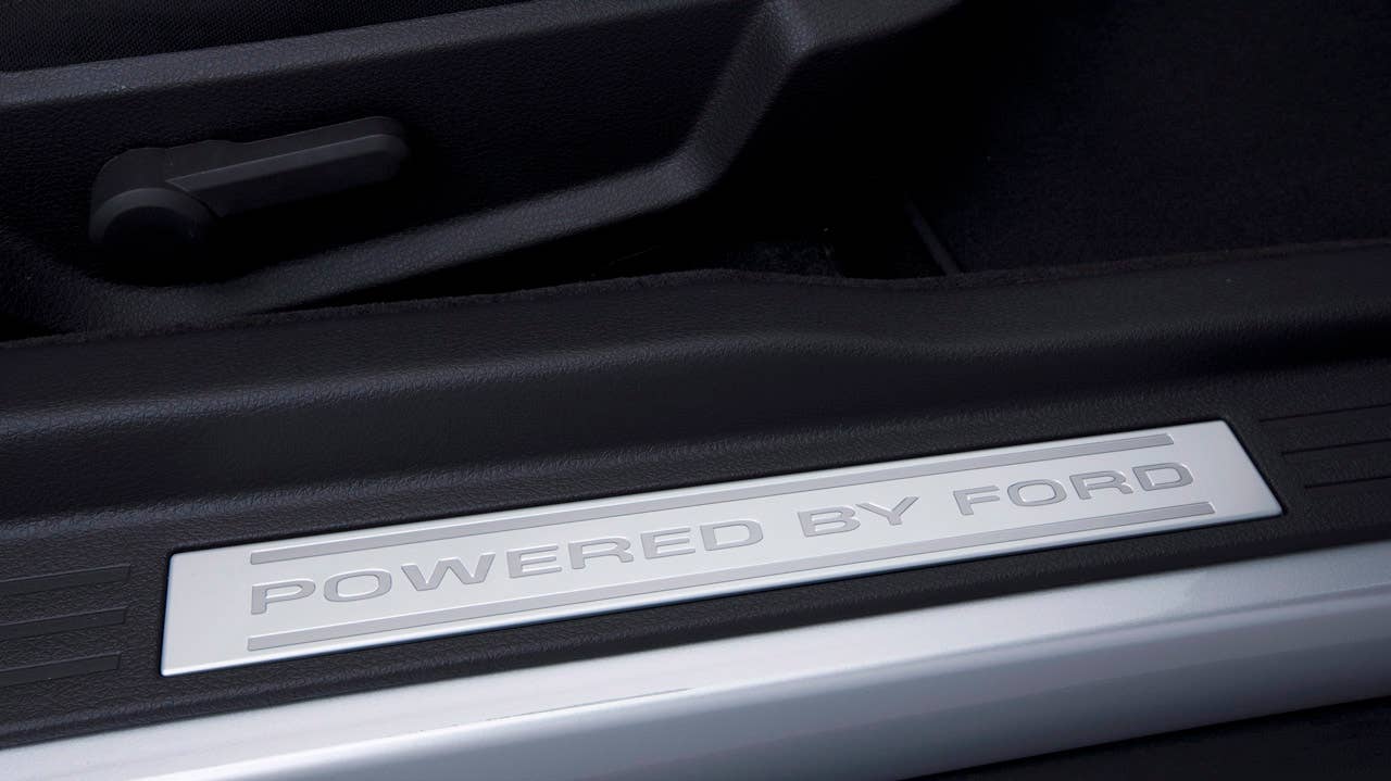 2012 Ford Mustang Boss 302: 'Powered by Ford' door sill plates remind Boss 302 and Laguna Seca drivers they're in a special car. (08/13/2010)