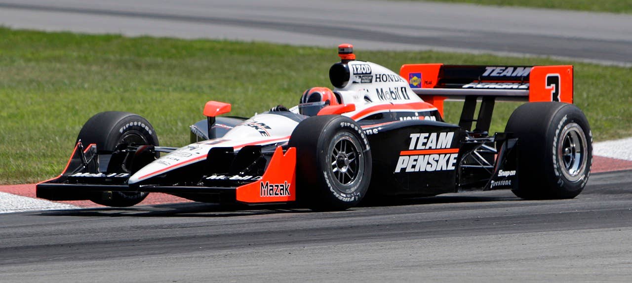 IRL driver Helio Castroneves, of Brazil, drives during qualifying for the IndyCar Series' Honda Indy 200 at Mid-Ohio Saturday, Aug. 7, 2010, in Lexington, Ohio. Castroneves qualified in sixth position. (AP Photo/Jay LaPrete)