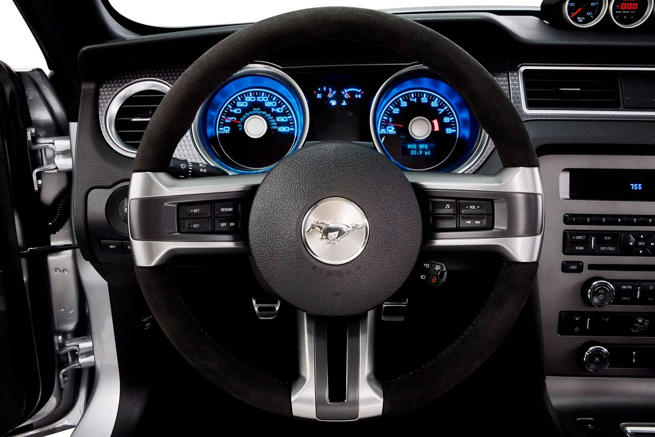 2012 Ford Mustang Boss 302: 2012 Mustang Boss 302 interior showing standard Alcantara-covered steering wheel and IP treatment. (08/13/2010)