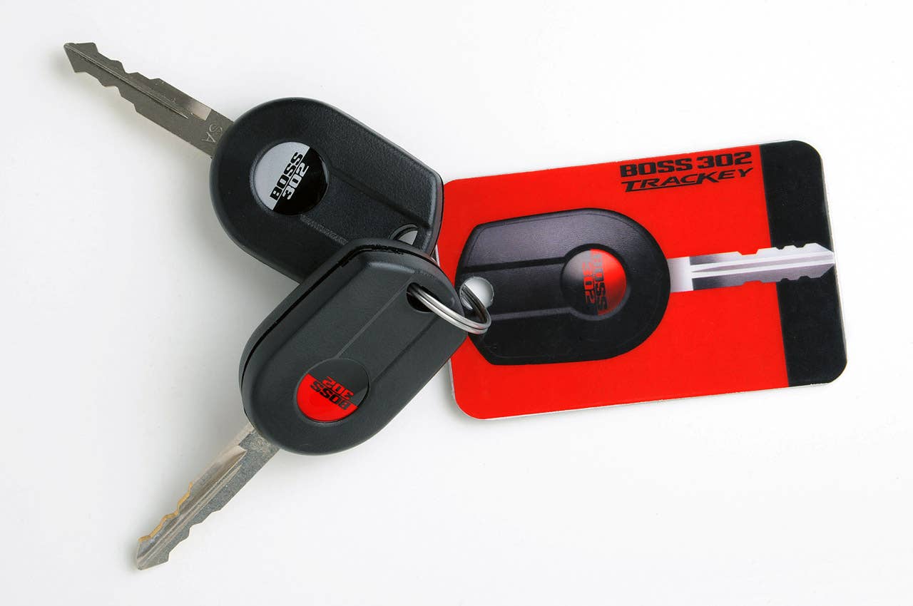 DEARBORN, Mich., Nov. 11, 2010 - You hold two keys: One has a black Boss logo, the other red: Either will start your 2012 Mustang Boss 302. Slide the all-black key into the lock cylinder, give it a twist and you're treated to 444 ponies worth of smooth, streetable driving joy. Or choose red - the TracKey - and you have a competition-ready track car. (11/11/2010)