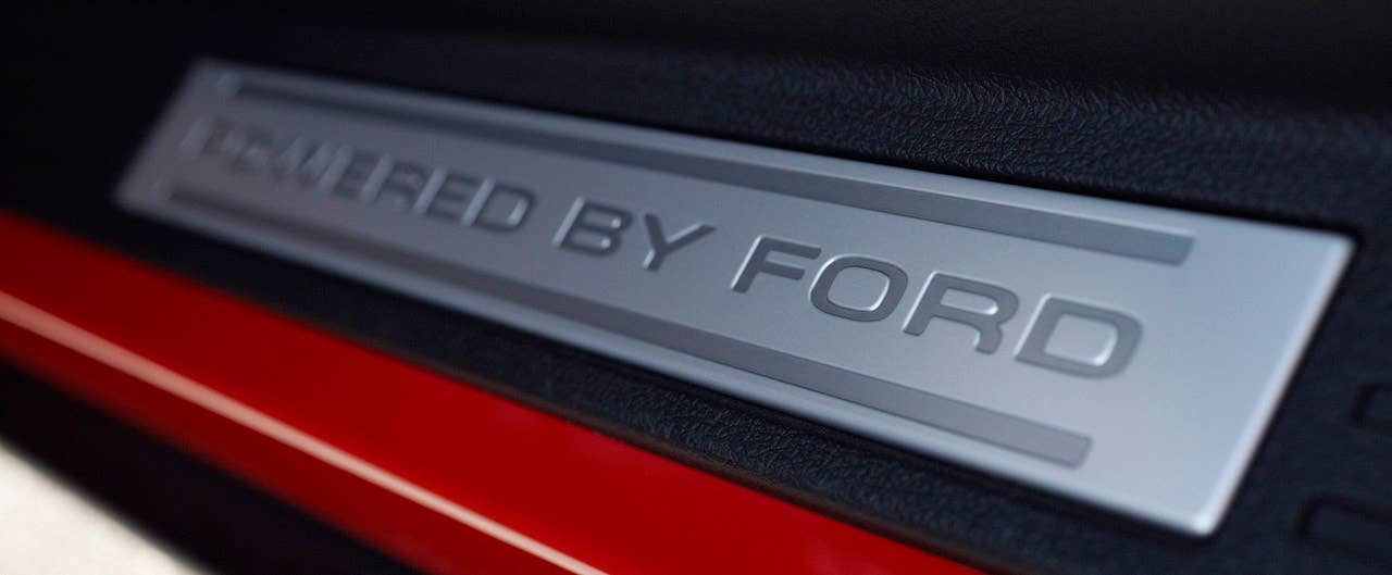 2012 Ford Mustang Boss 302: 'Powered by Ford' door sill plates remind Boss 302 and Laguna Seca drivers they're in a special car. (08/13/2010)