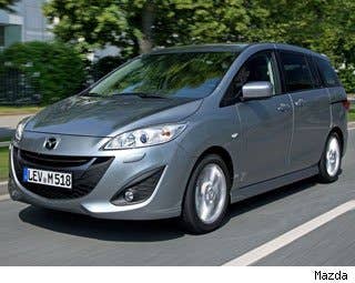 MSRP: $19,625 - $24,025 Invoice: $18,771 - $22,975 Fuel Economy: 21 mpg City, 28 mpg Highway  TheMazda5 is technically not a minivan, but consumers on AOL Autos research it like it is one, so we put it on the list. Mazda would like it to be called a "multi-activity vehicle" -- because they know that many people abhor the word "minivan" -- but it is what it is.  The car seats six, has sliding minivan-esque doors, and many of its customers have families.  Mazda hasn't yet released details of its 2013 Mazda5. The car might get Mazda's SkyActive technologies, which helps increase fuel economy and increase engine output. AOL Autos Editors, all of whom have tested it, agree it is a terrific alternative to a traditional minivan, though we all have our affections for different minivans as well.  But since the car was mostly redesigned for 2012, we don't expect many changes.  The Mazda5 is a good option for customers who need room for families, dogs, or maybe even bikes, but want to get better fuel economy.  Research the Mazda5 Mazda5 Photos & Information Mazda5 Best Deals Mazda5 Local Dealer Price Quote