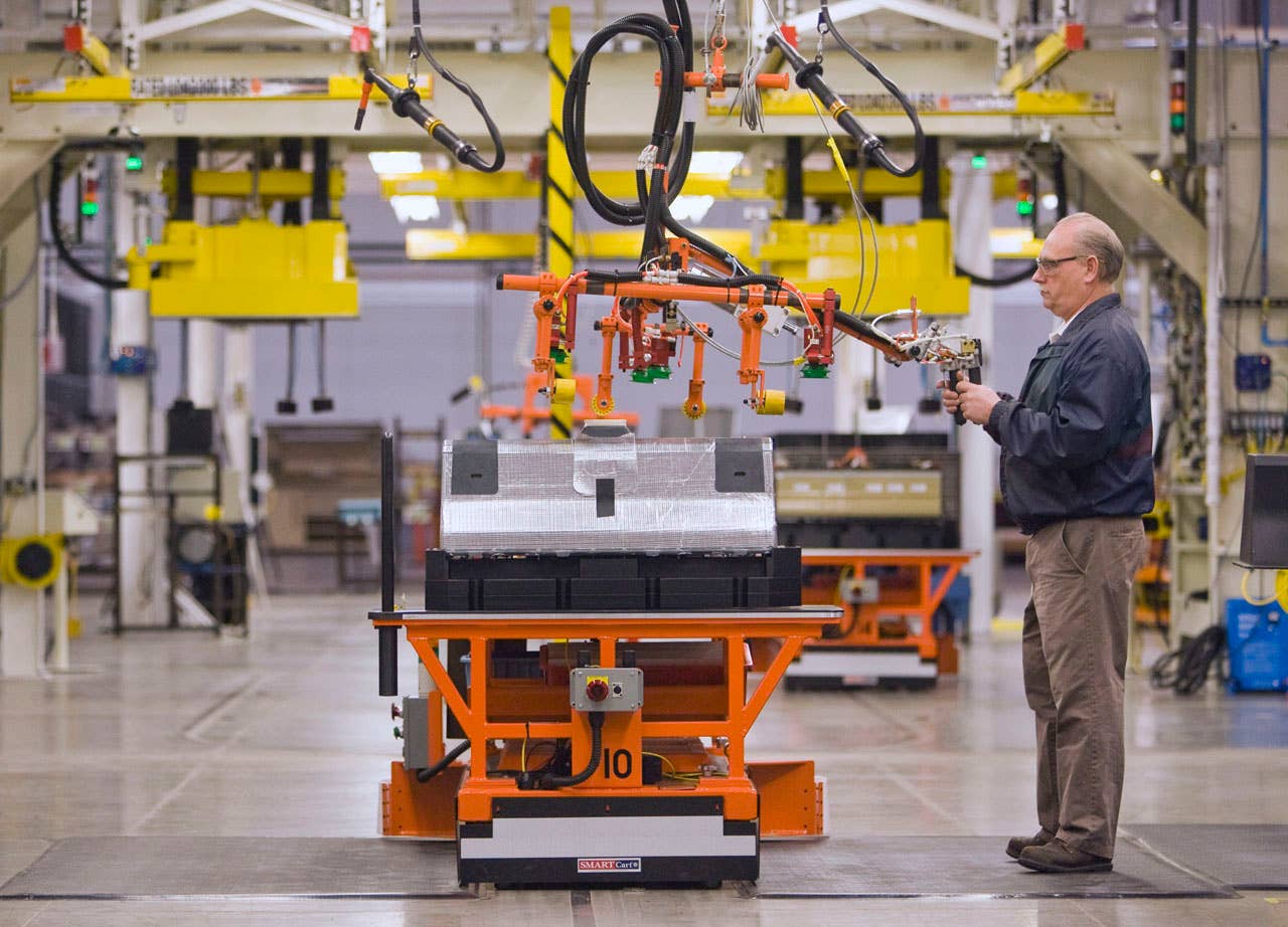 The first Chevrolet Volt battery moves through the assembly process at the General Motors Brownstown Battery plant in Brownstown Township, Michigan Tuesday, December 22, 2009. The Brownstown facility is the first lithium-ion battery pack manufacturing plant in the U.S. operated by a major automaker. (Photo by Jeffrey Sauger for General Motors)