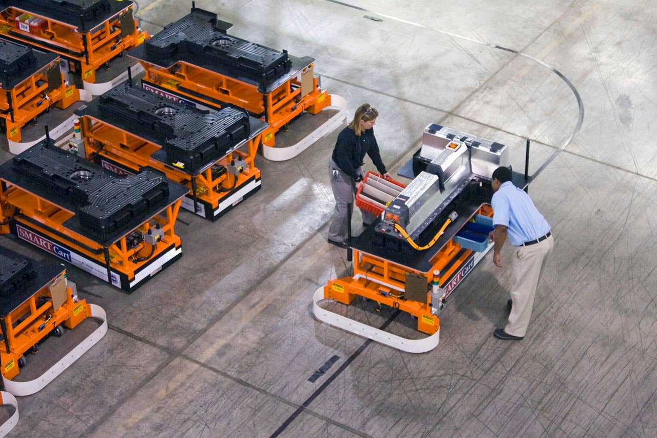 The first Chevrolet Volt battery makes its way through the General Motors Brownstown Battery plant on an automated guided cart (AGC) in Brownstown Township, Michigan Tuesday, December 22, 2009. The Brownstown facility is the first lithium ion battery pack manufacturing plant in the U.S. operated by a major automaker. (Photo by Jeffrey Sauger for General Motors)