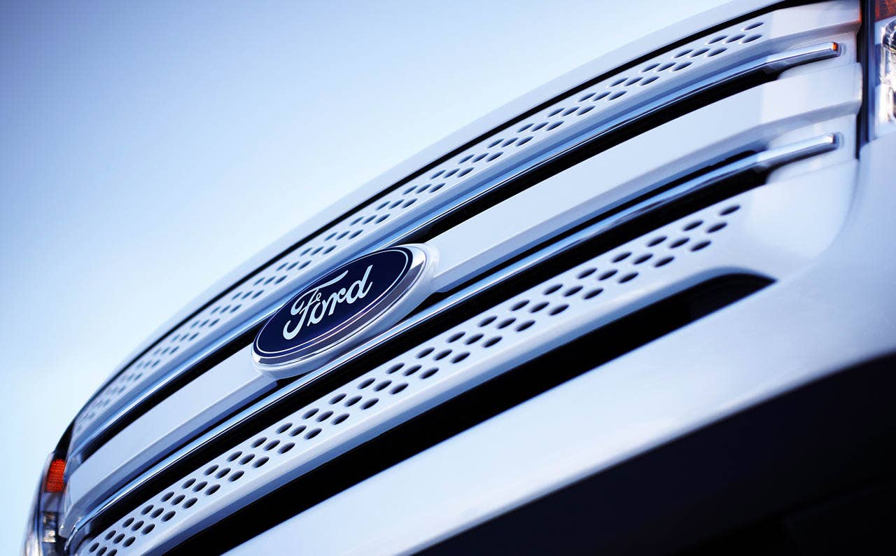 2011 Ford Explorer: The Ford signature three bar grille proudly displays the Blue Oval logo.  (07/26/2010)
