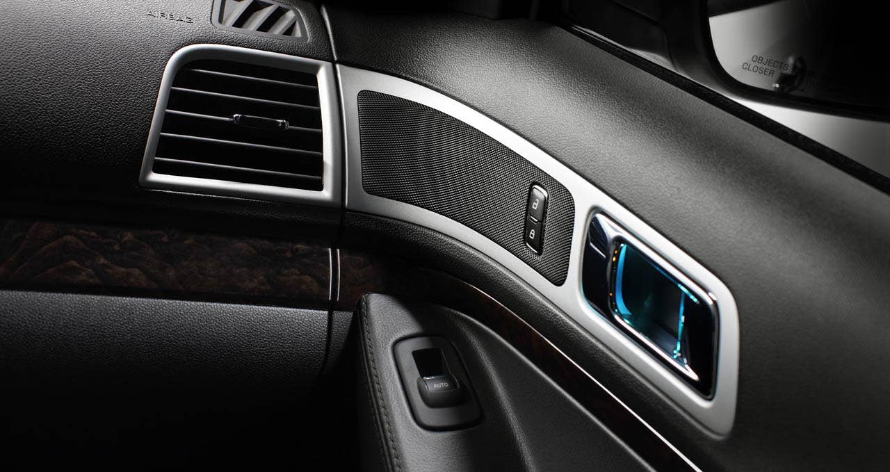 2011 Ford Explorer: Door panel speaker grilles are real metal, giving the interior a sporty, purposeful look. (07/26/2010)