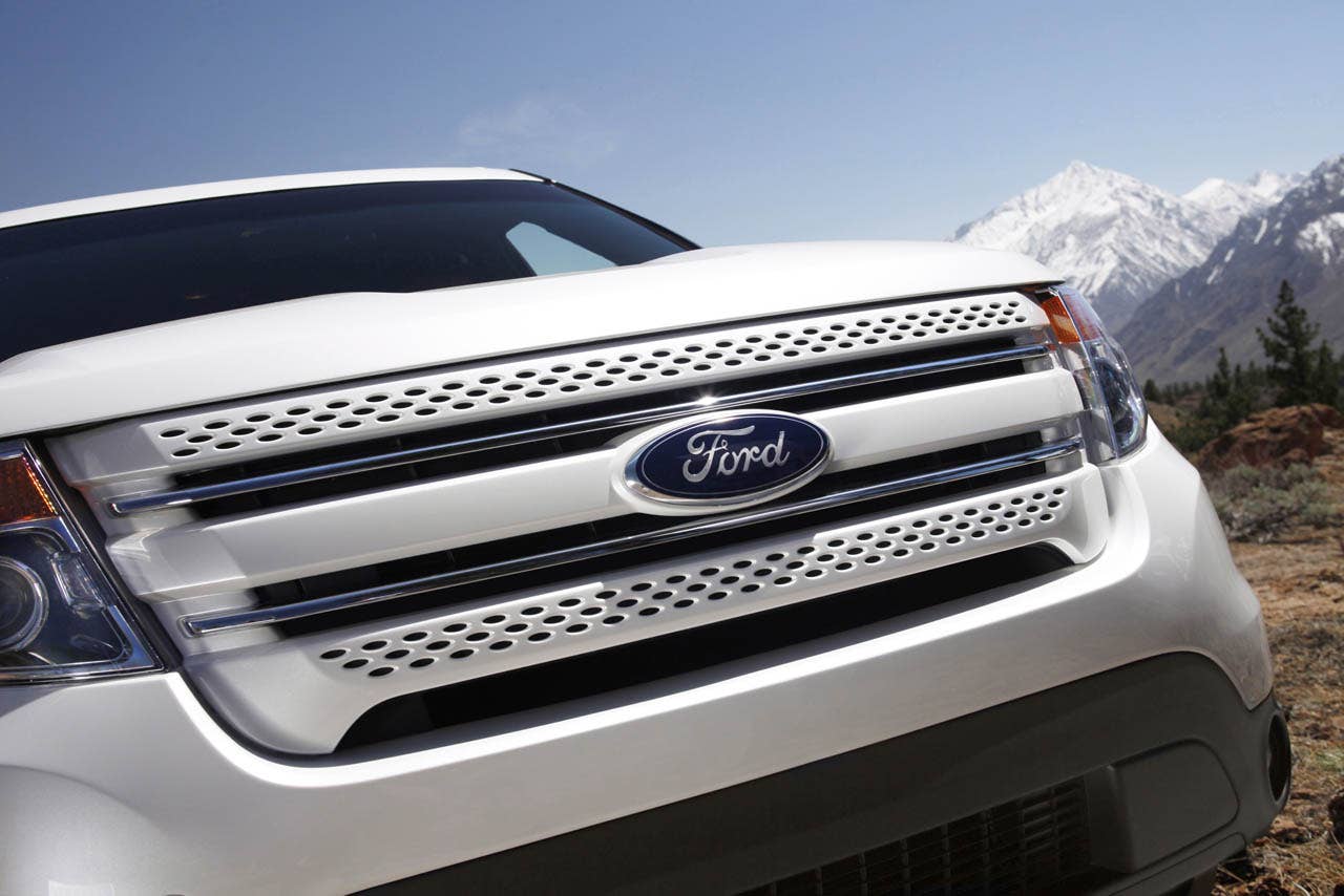 2011 Ford Explorer: Behind the three-bar grille, Explorer features a composite bolster supporting the radiator.  This innovative component saves weight - and fuel - while reducing manufacturing complexity.  (07/26/2010)
