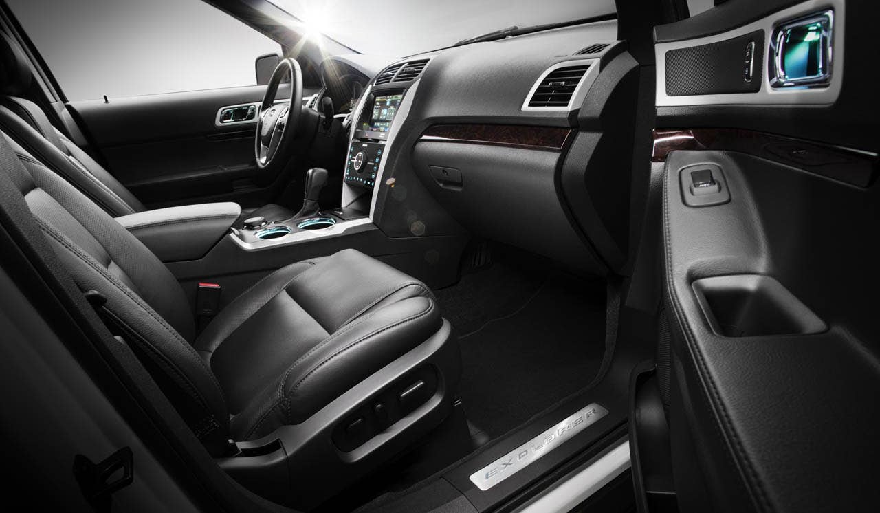 2011 Ford Explorer: Real metal speaker grilles and the forward-leaning center stack give the Explorer interior a sporty look. (07/26/2010)