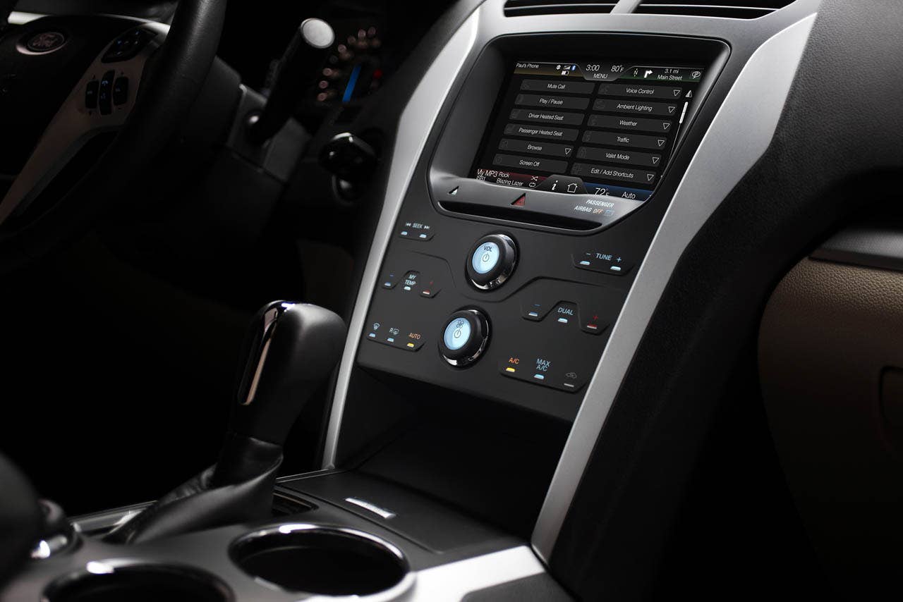 2011 Ford Explorer: The center console features a media hub for connectivity and mobile device concealed storage. (07/26/2010)