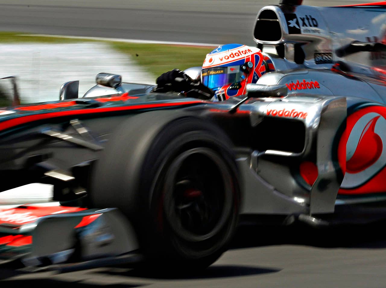 McLaren Mercedes driver Jenson Button, of Britain, races to a second-place finish Sunday, June 13, 2010, at the Formula One Canadian Grand Prix auto race in Montreal. (AP Photo/The Canadian Press,Jacques Boissinot)
