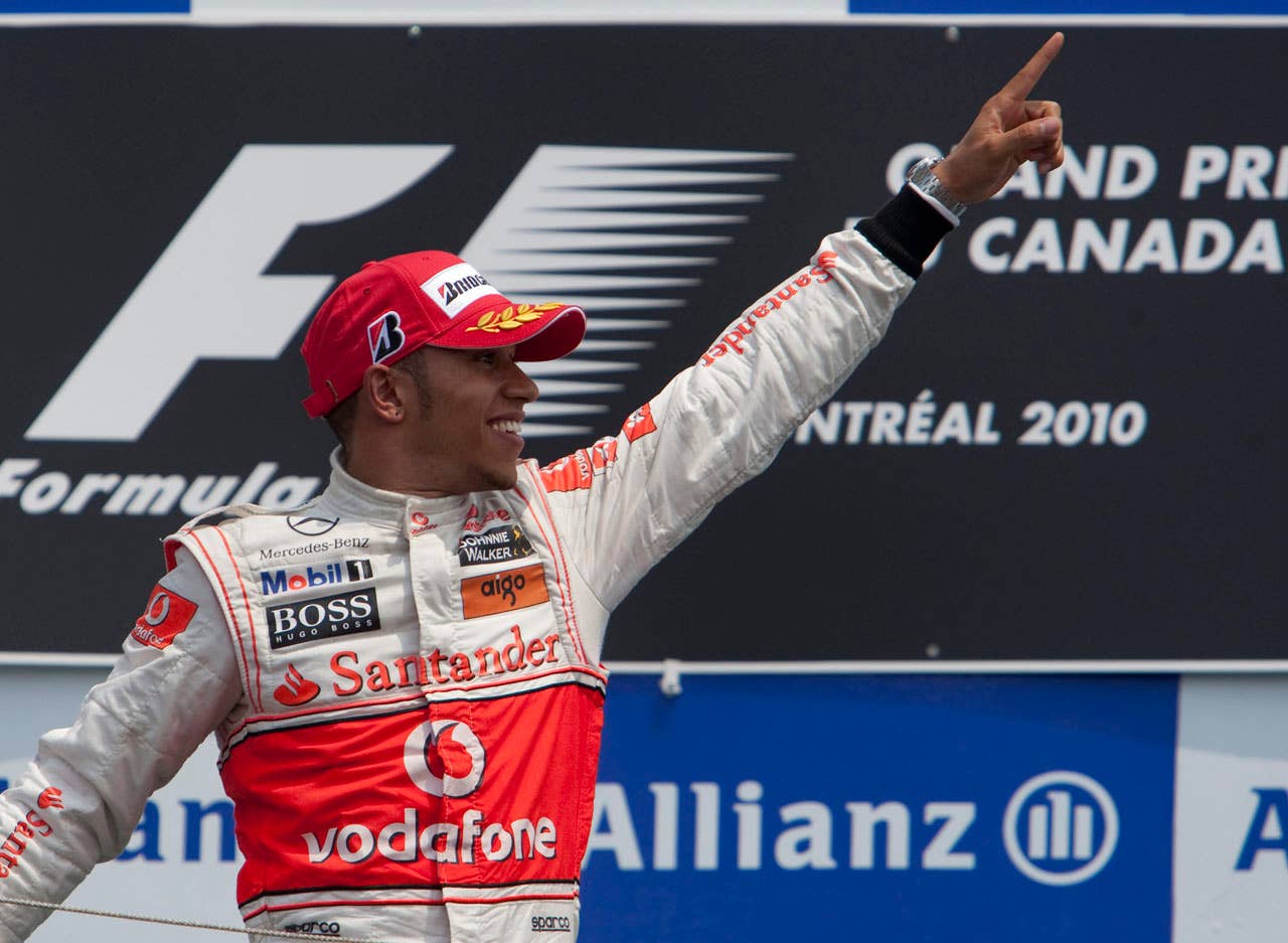 McLaren Mercedes driver Lewis Hamilton of Britain  celebrates after winning  the Canadian Grand Prix Sunday, June 13, 2010  in Montreal. (AP Photo/The Canadian Press,Ryan Remiorz)