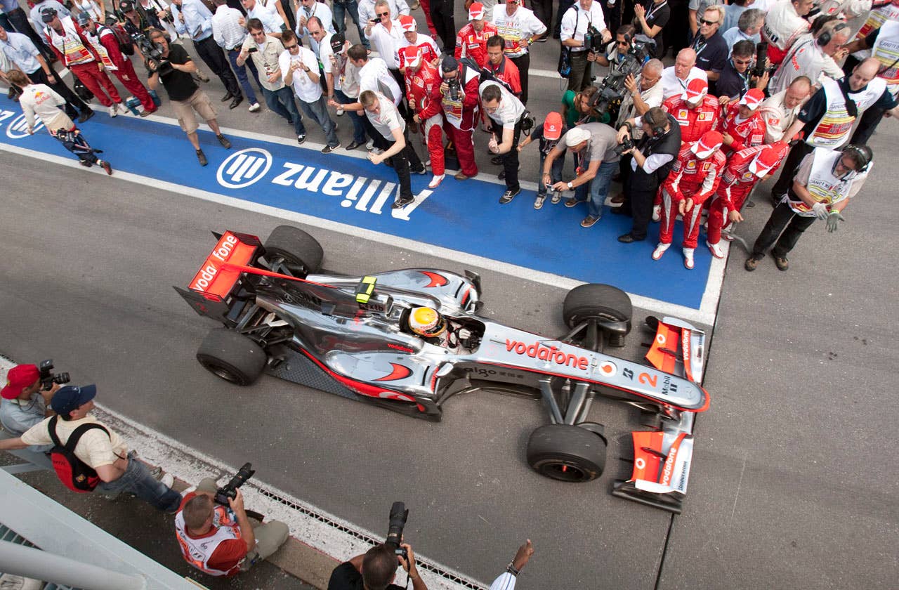 McLaren Mercedes driver Lewis Hamilton of Britain drives to the winner's circle after winning the Canadian Grand Prix, Sunday, June 13, 2010 in Montreal.  (AP Photo/The Canadian Press,Paul Chiasson)