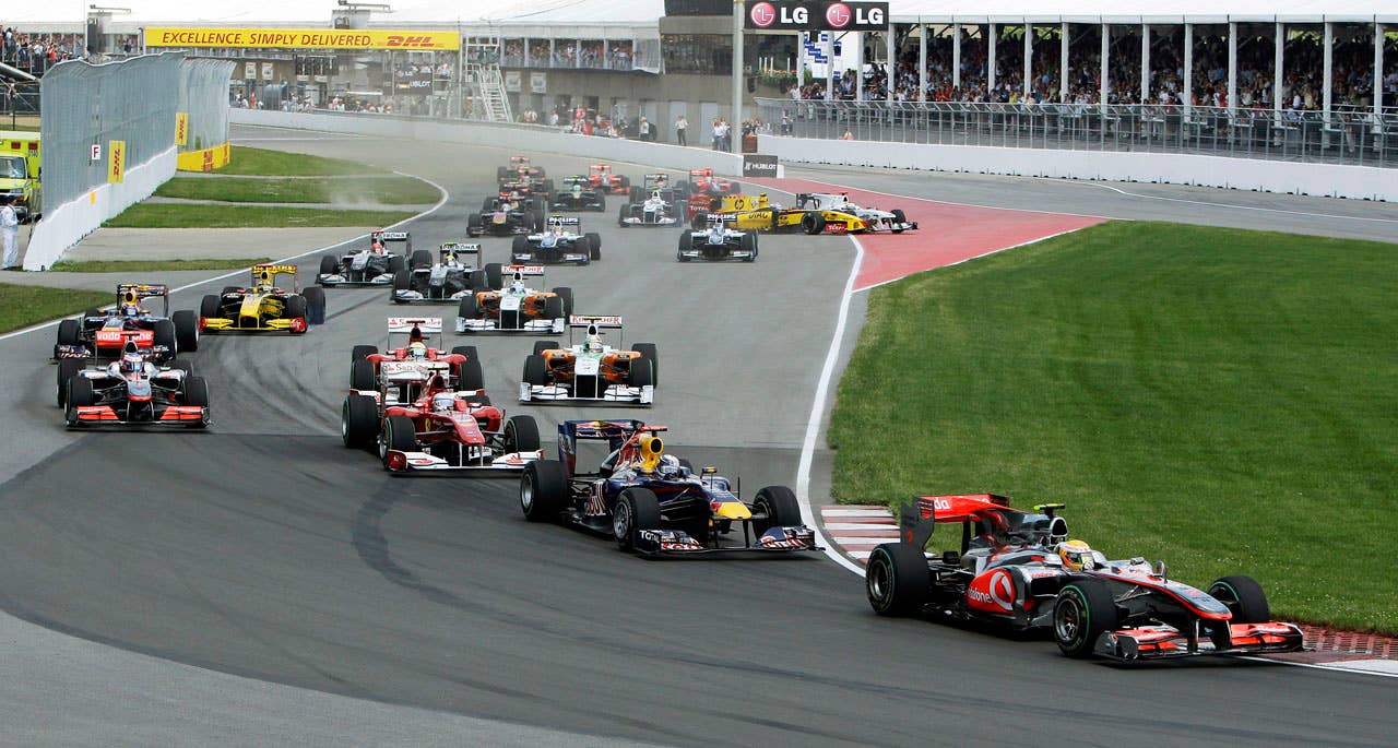 McLaren Mercedes driver Lewis Hamilton of Britain leads the field in the first turn for the start of the Canadian Grand Prix auto race in Montreal, Sunday, June 13, 2010. (AP Photo/Darron Cummings)
