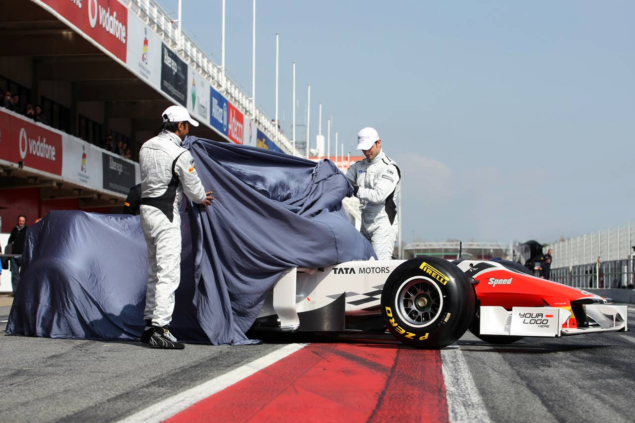 Narain Karthikeyan (IND) Hispania Racing F1 Team (HRT) and Vitantonio Liuzzi (ITA) Hispania Racing F1 Team (HRT) take the covers off the new HRT F111. Formula One Testing, Day 4, Barcelona, Spain, Friday 11 March 2011.