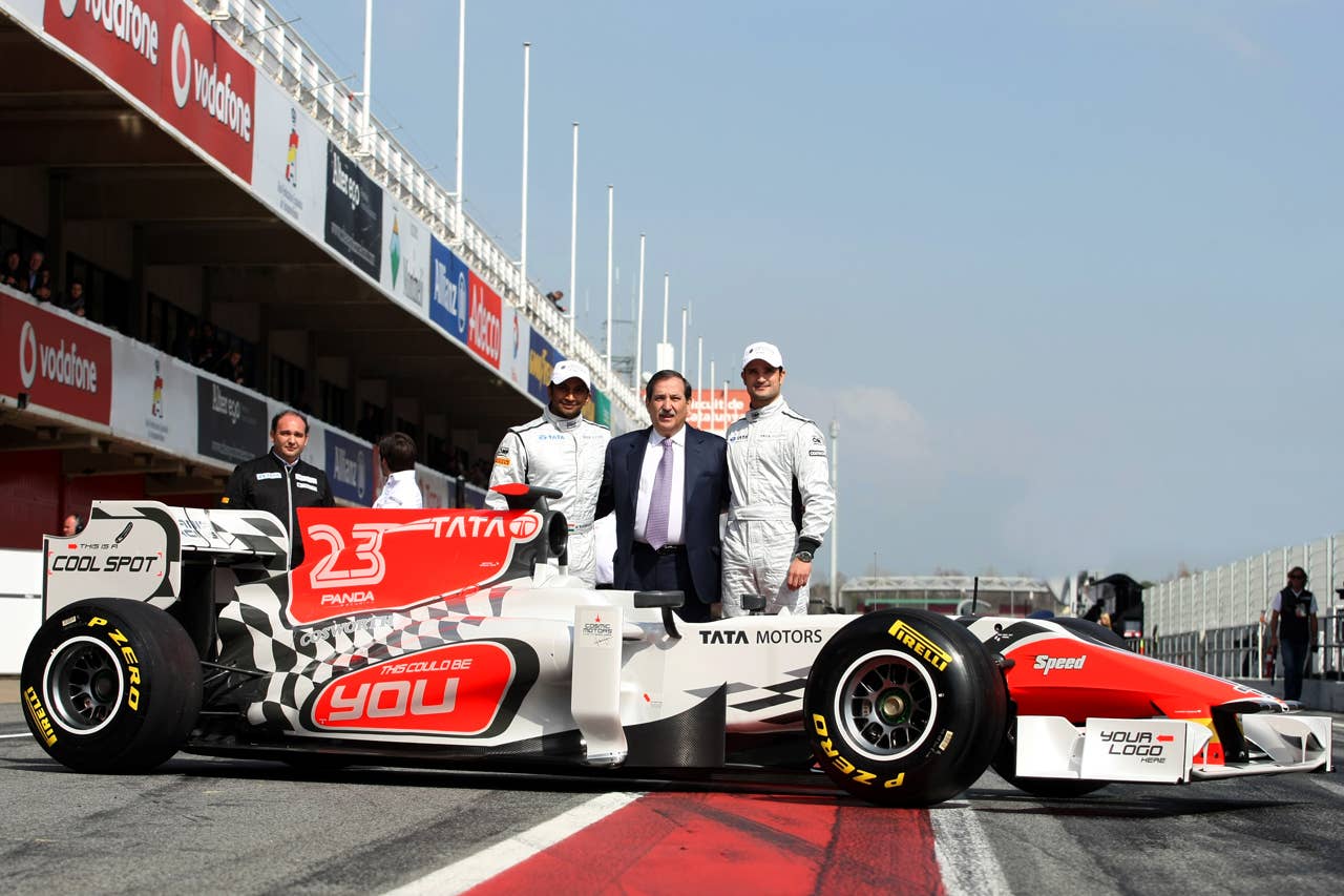 (L to R): Narain Karthikeyan (IND) Hispania Racing F1 Team (HRT), Jose Ramon Carabante (ESP) Hispania Racing F1 Team (HRT) Team Owner, and Vitantonio Liuzzi (ITA) Hispania Racing F1 Team (HRT) with the new HRT F111. Formula One Testing, Day 4, Barcelona, Spain, Friday 11 March 2011.