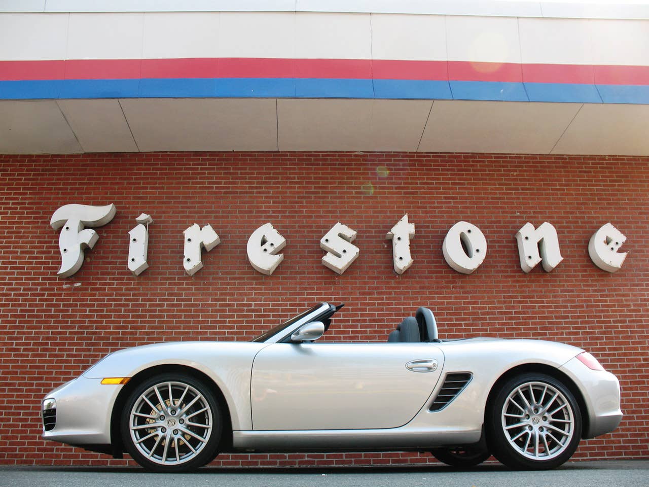 For the record, the Boxster isn't wearing Firestones. I just love the sign and liked how the photo came out, so into the gallery it went.