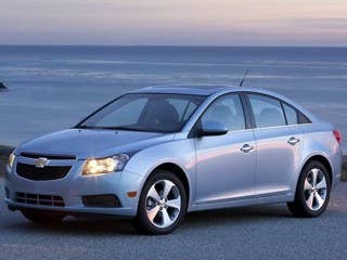 The Chevy Cruz has been lauded by several automotive outlets, including AOL Autos. Our favorite version is the Cruze Eco, which gets 42 mpg to a reduction in weight and a turbo-charged 1.4 liter inline four cylinder engine. It also has a six-speed manual, which is not everyone's cup of tea, but we like it. We saw highway fuel economy of 50 mpg when we were cursing in sixth gear. That's just awesome with a non-hybrid and non-diesel car. The Cruze does, of course, come with an automatic transmission as well. And this year, the compact sedan will also come as a diesel. Yup. Chevy is finally giving us a clean-diesel passenger car, just like Volkswagen and other Germans have been offering U.S. drivers for years.  The Cruze is a taut driver, with sufficient backseat room and trunk space for a car in this class. It stacks up perfectly well to stalwarts in the category, such as Toyota Corolla and Honda Civic, and many of our staff prefers it to both of those models. Chevy nailed it with the Cruze. The company should put the team that engineered and planned it on the next Malibu sedan to make that car as good.  The base Cruze starts at $17,130, and goes up to $23,550 for the top of the line six-speed automatic LTZ trim level. The sweet-spot for value here is the Cruze ECO automatic for $20,875.