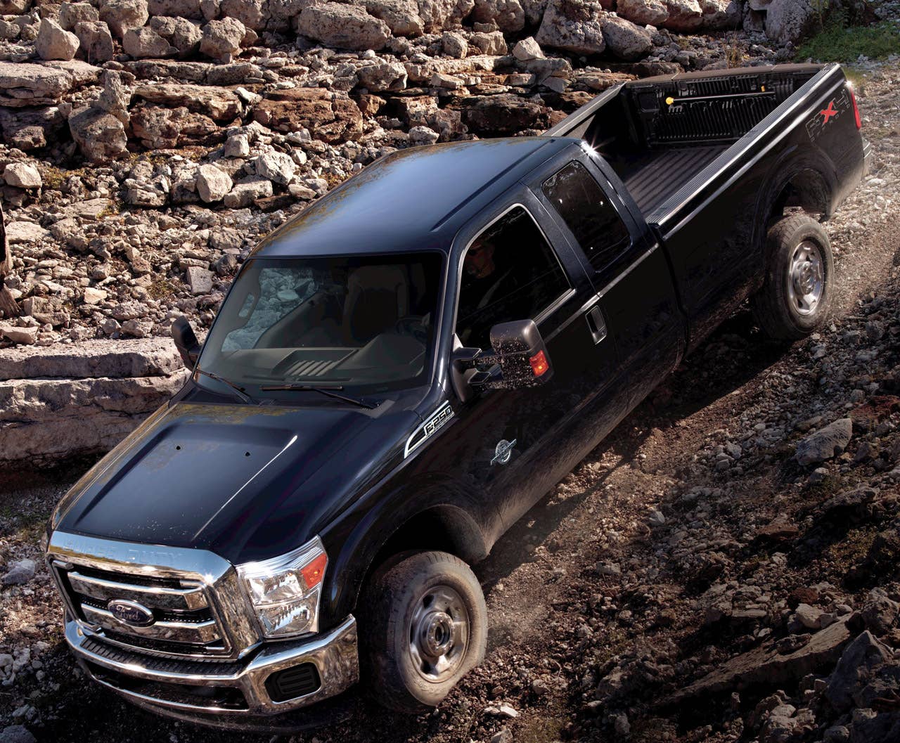 2011 Ford F-250 Super Duty: At the push of a button, available new Hill Descent Control helps maintain the speed of the truck on steep declines. It allows the customer to concentrate on driving rather than modulating the brakes, increasing off-road confidence. (2/25/2010)