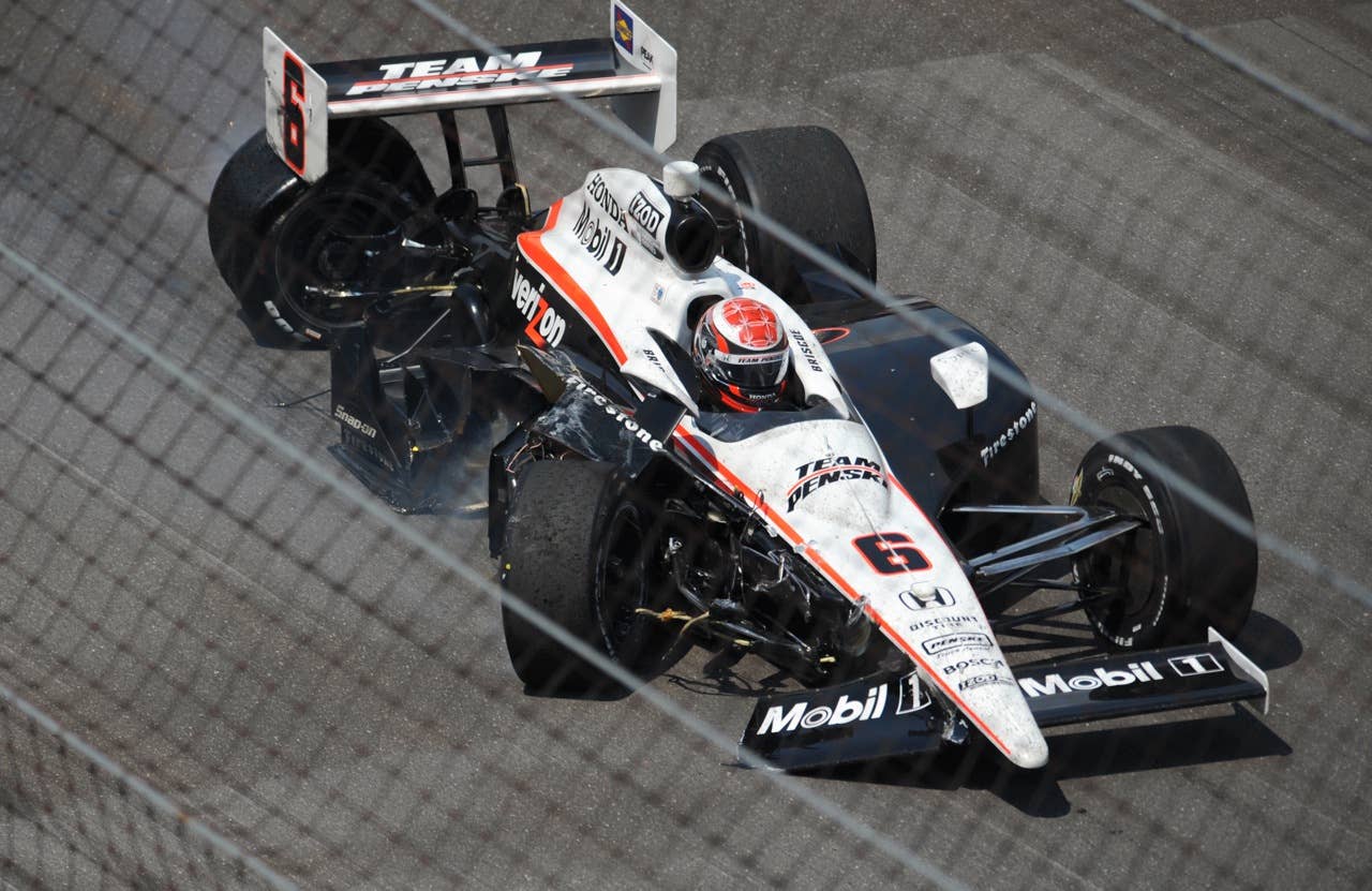 Ryan Briscoe, of Australia, is seen after crashing into the wall during the Indianapolis 500 auto race at the Indianapolis Motor Speedway in Indianapolis, Sunday, May 30, 2010. (AP Photo/Chris Howell)