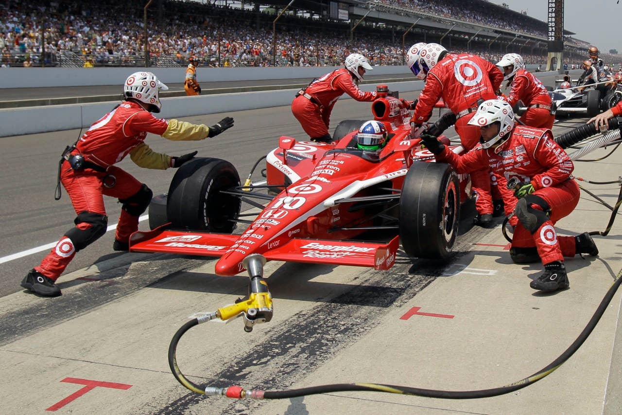 Dario Franchitti, of Scotland, makes a pit stop during the Indianapolis 500 auto race at the Indianapolis Motor Speedway in Indianapolis, Sunday, May 30, 2010. (AP Photo/Darron Cummings)