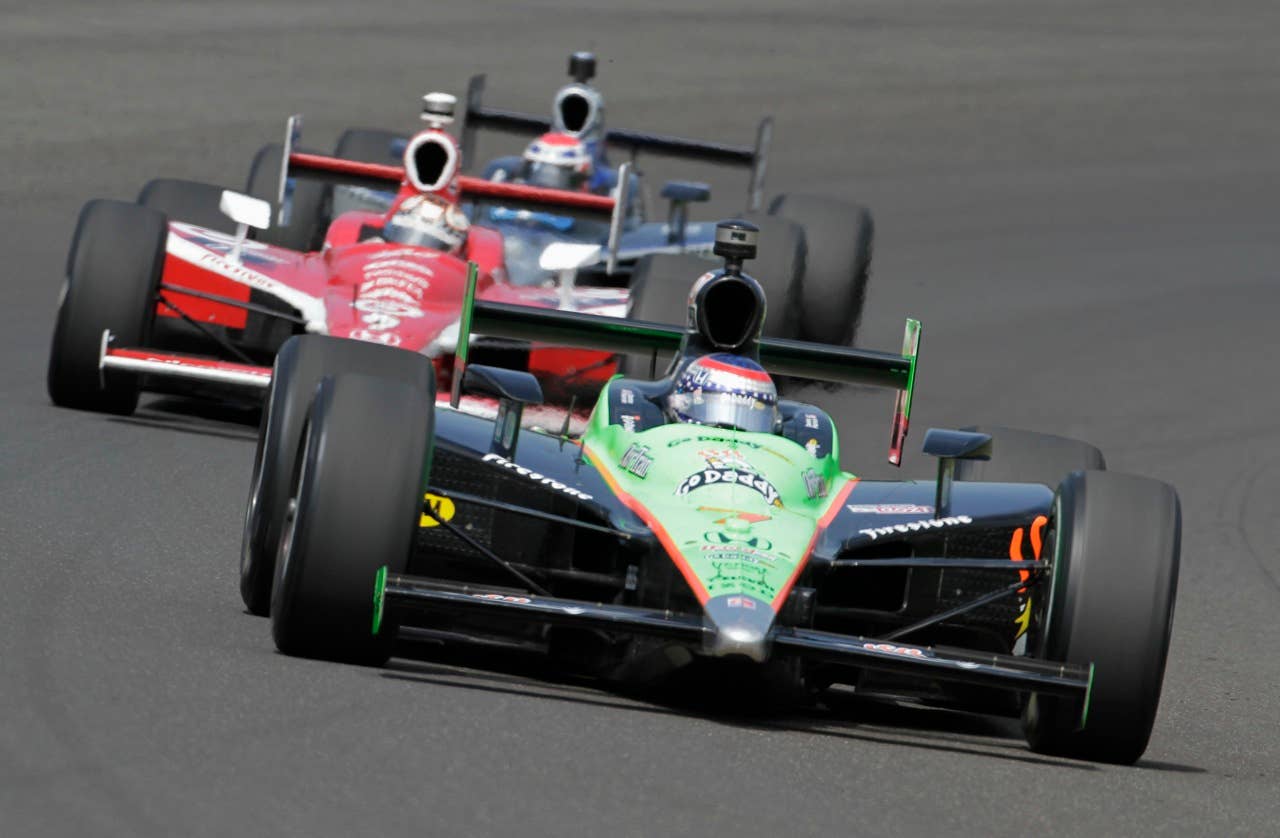 Danica Patrick comes through the first turn ahead of on the final day of practice for the Indianapolis 500 auto race at the Indianapolis Motor Speedway in Indianapolis, Friday, May  28, 2010. The Race will be run Sunday. (AP Photo/Tom Strattman)