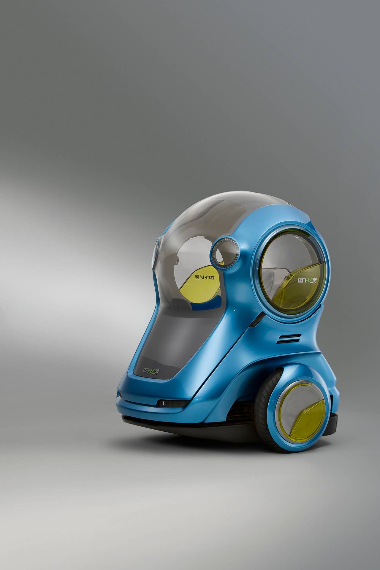 EN-V, which is short for Electric Networked-Vehicle, maintains the core principle of personal mobility - freedom - while helping remove the motor vehicle from the environmental debate and redefining design leadership.EN-V is a two-seat electric vehicle that was designed to alleviate concerns surrounding traffic congestion, parking availability, air quality and affordability for tomorrow's cities. The Xiao (Laugh) model (pictured) was unveiled today in Shanghai alongside Jiao (Pride) and Maio (Magic). They represent three different characteristics which emphasize that future transportation can be fun. X10CO_SV029 (03/24/2010)