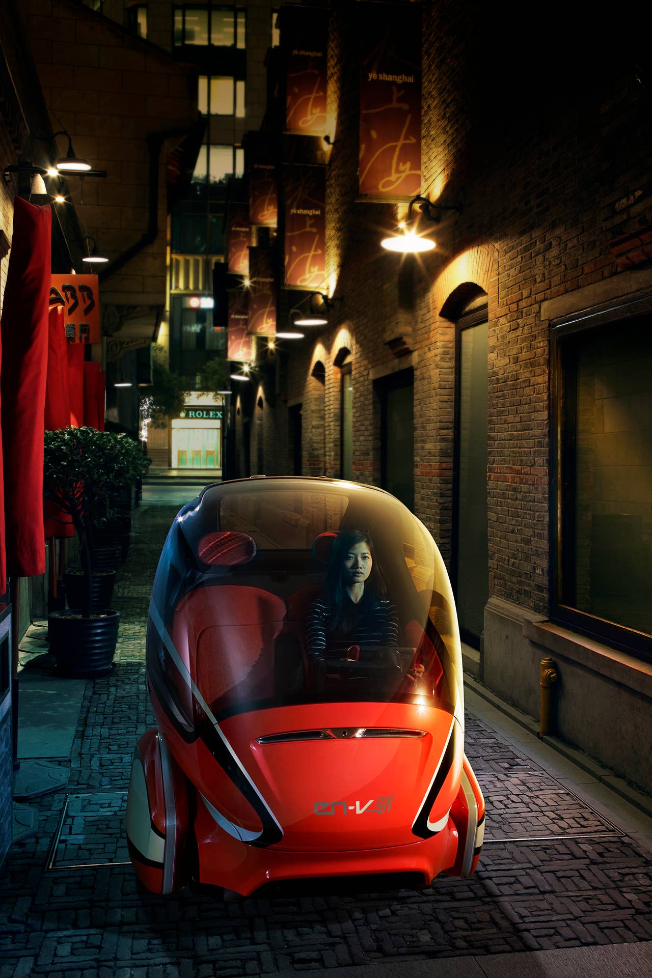 EN-V, which is short for Electric Networked-Vehicle, maintains the core principle of personal mobility - freedom - while helping remove the motor vehicle from the environmental debate and redefining design leadership. EN-V is a two-seat electric vehicle that was designed to alleviate concerns surrounding traffic congestion, parking availability, air quality and affordability for tomorrow's cities. The Jiao (Pride) model (pictured) was unveiled today in Shanghai alongside Xiao (Laugh) and Maio (Magic). They represent three different characteristics which emphasize that future transportation can be fun. X10CO_SV001 (03/24/2010)