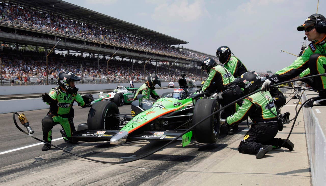 Danica Patrick makes a pit stop during the Indianapolis 500 auto race at Indianapolis Motor Speedway in Indianapolis, Sunday, May 30, 2010. (AP Photo/Jeff Roberson)