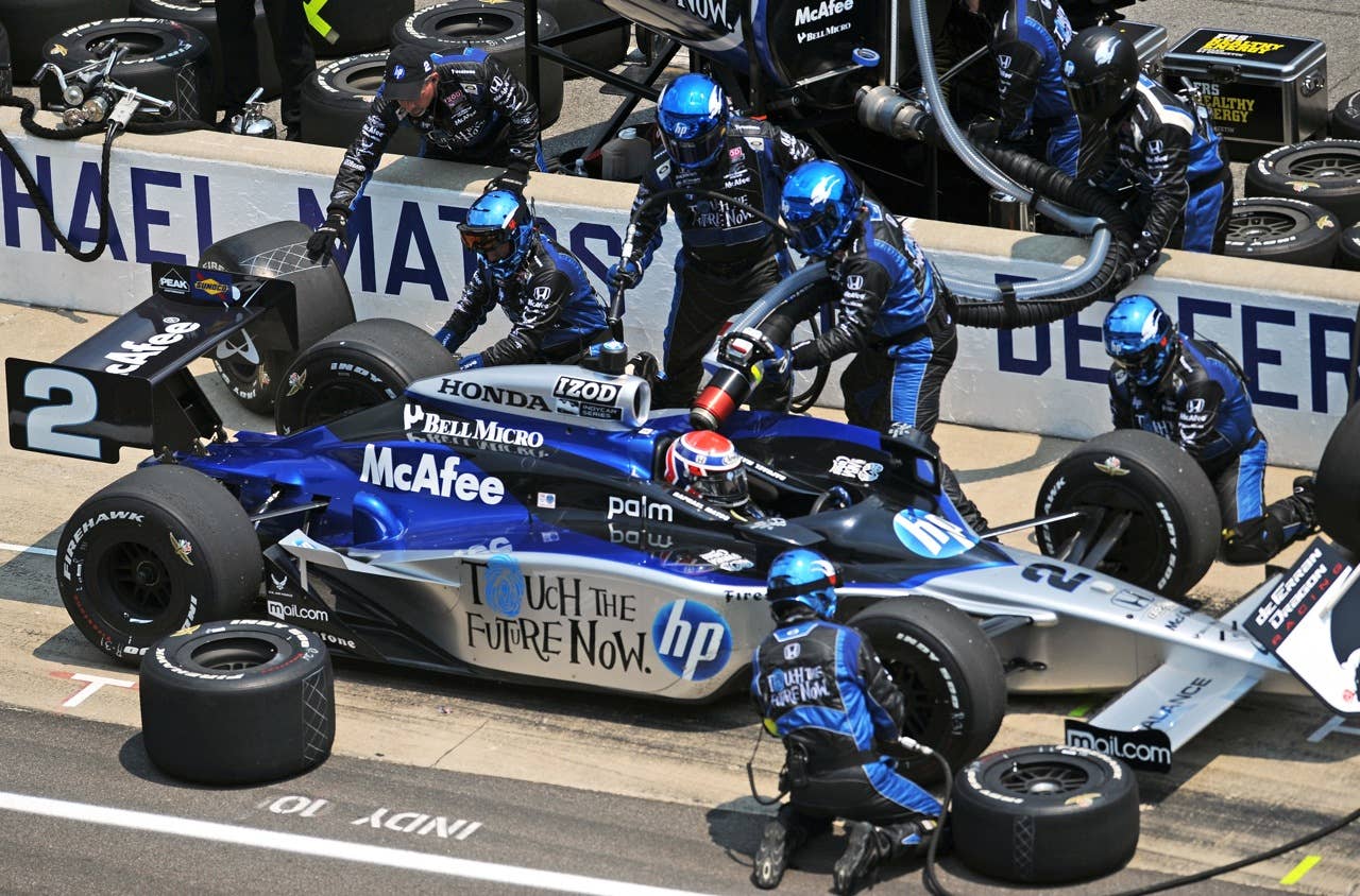 Raphael Matos, of Brazil, makes a pit stop during Indianapolis 500 auto race at the Indianapolis Motor Speedway in Indianapolis, Sunday, May 30, 2010. (AP Photo/Chris Howell)