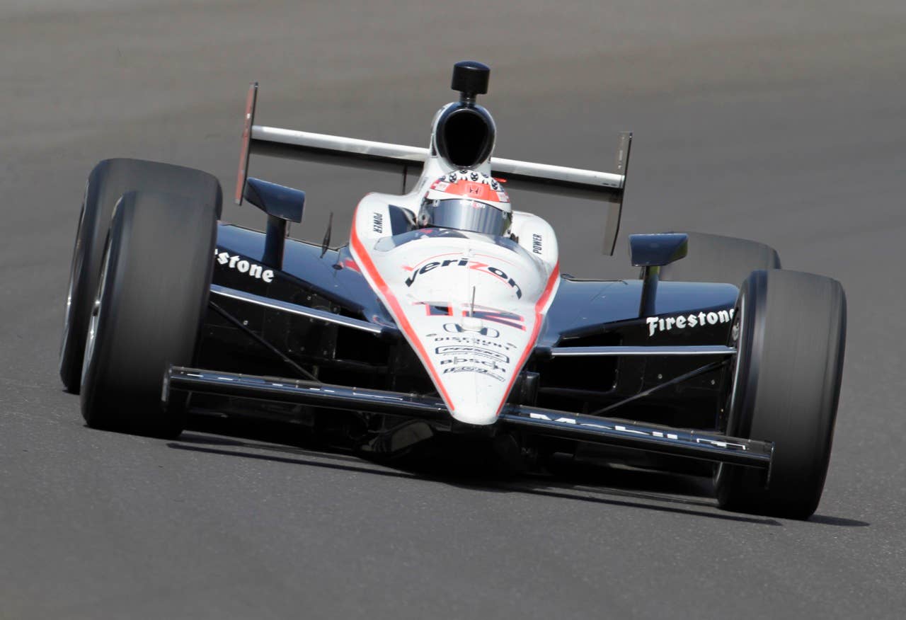Will Power, of Australia, comes through a turn on the final day of practice for the Indianapolis 500 auto race at the Indianapolis Motor Speedway in Indianapolis, Friday, May  28, 2010. The race will be run Sunday. (AP Photo/Tom Strattman)