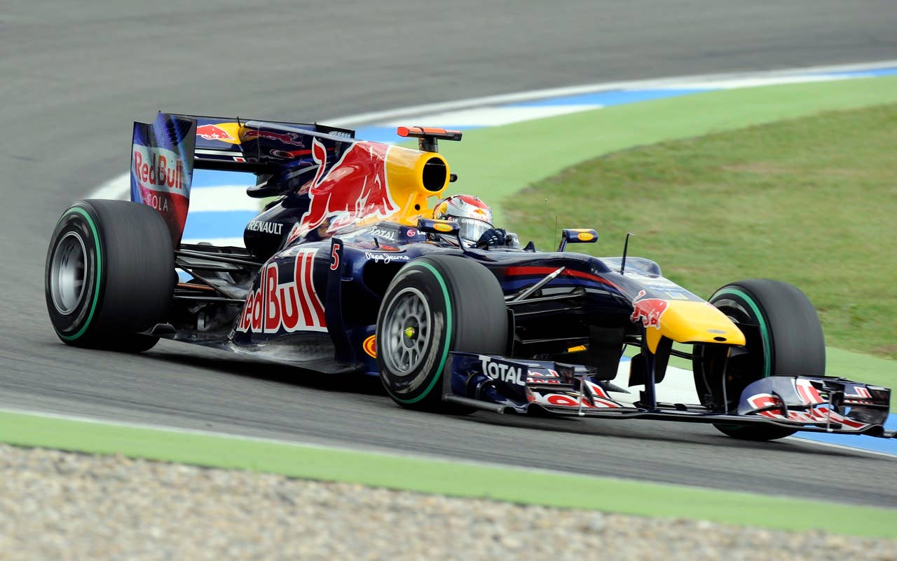 Red Bull Formula One driver Sebastian Vettel of Germany drives on the pole position during the Qualifying at the race track in Hockenheim, Germany, Saturday, July 24, 2010. Sebastian Vettel of Germany has edged Fernando Alonso  to take pole position for the Formula One German Grand Prix. Vettel's  Red Bull was .002 seconds faster than Alonso's Ferrari on Saturday to give the German his sixth pole of the season.  Felipe Massa of Brazil in the second Ferrari, who was third, and Mark Webber in the second Red Bull complete the two front rows for Sunday's race.   (AP Photo/Martin Meissner)