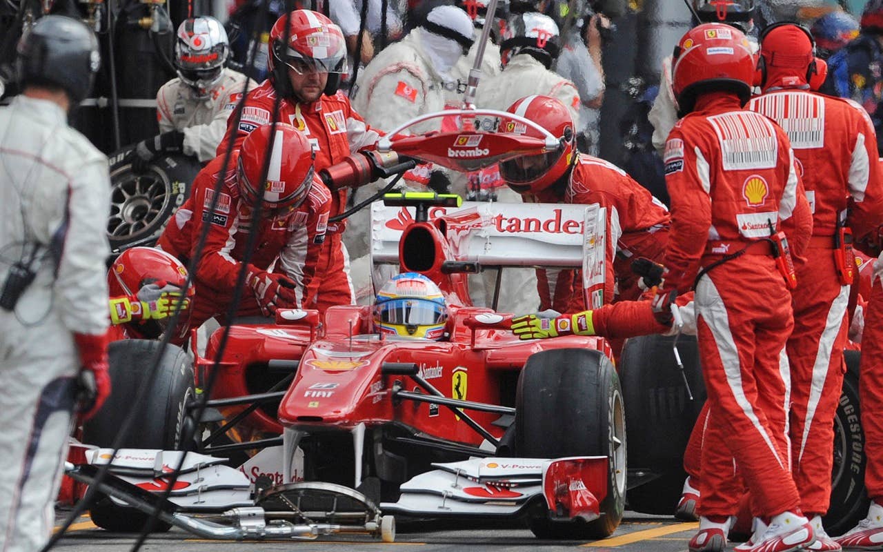 Winner Ferrari Formula One driver Fernando Alonso of Spain stops with his car in the pit lane during the German Formula One Grand Prix in Hockenheim, Germany, Sunday, July 25, 2010. (AP Photo/Jens Meyer)