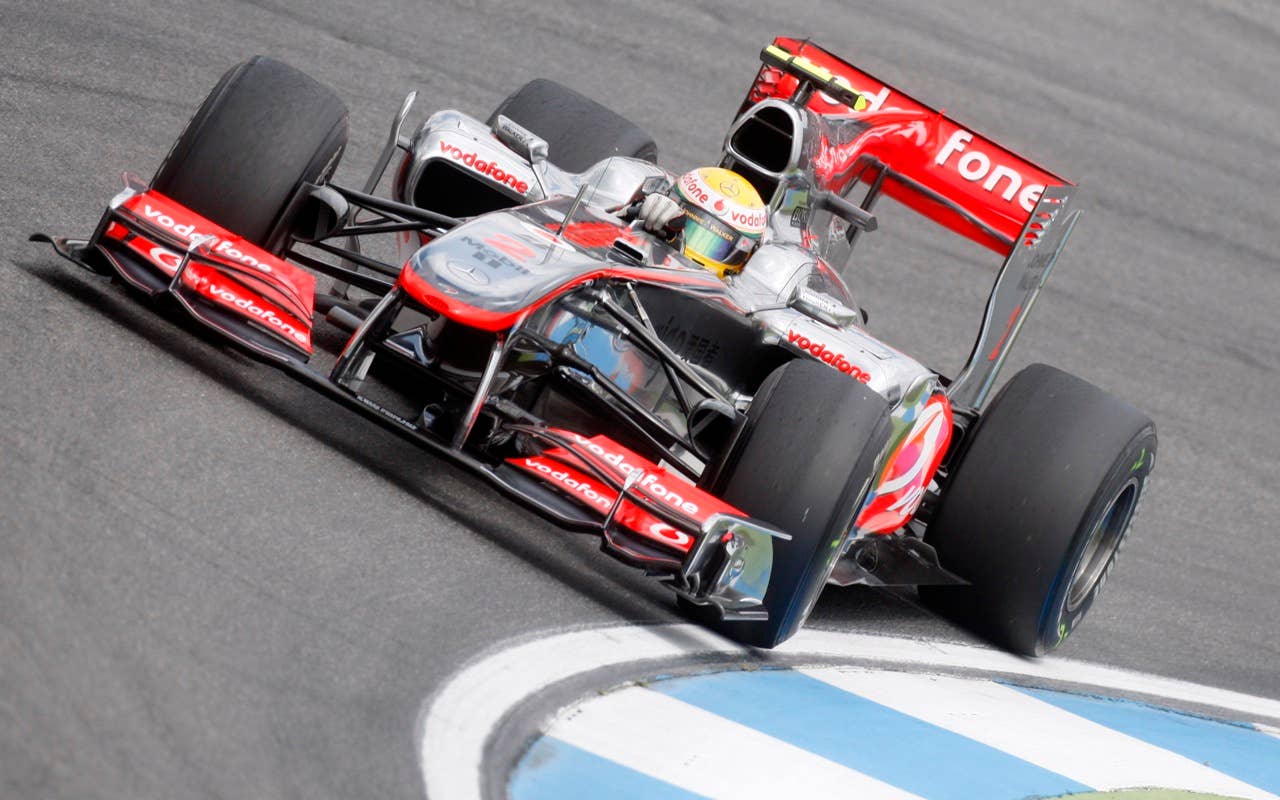 McLaren Mercedes Formula 1 driver Lewis Hamilton of England steers his car during the Qualifying at the race track in Hockenheim,  Germany, July 24, 2010. The race will take place on Sunday(AP Photo/Michael Probst)