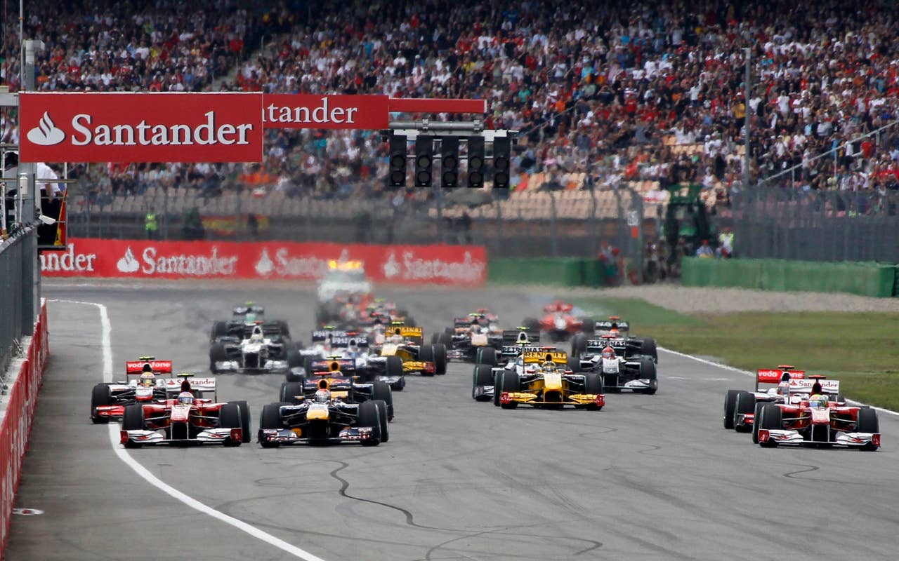 Red Bull Formula One driver Sebastian Vettel of Germany leads the pack at the start to the German Formula One Grand Prix in Hockenheim, Germany, Sunday, July 25, 2010. (AP Photo/Matthias Schrader)
